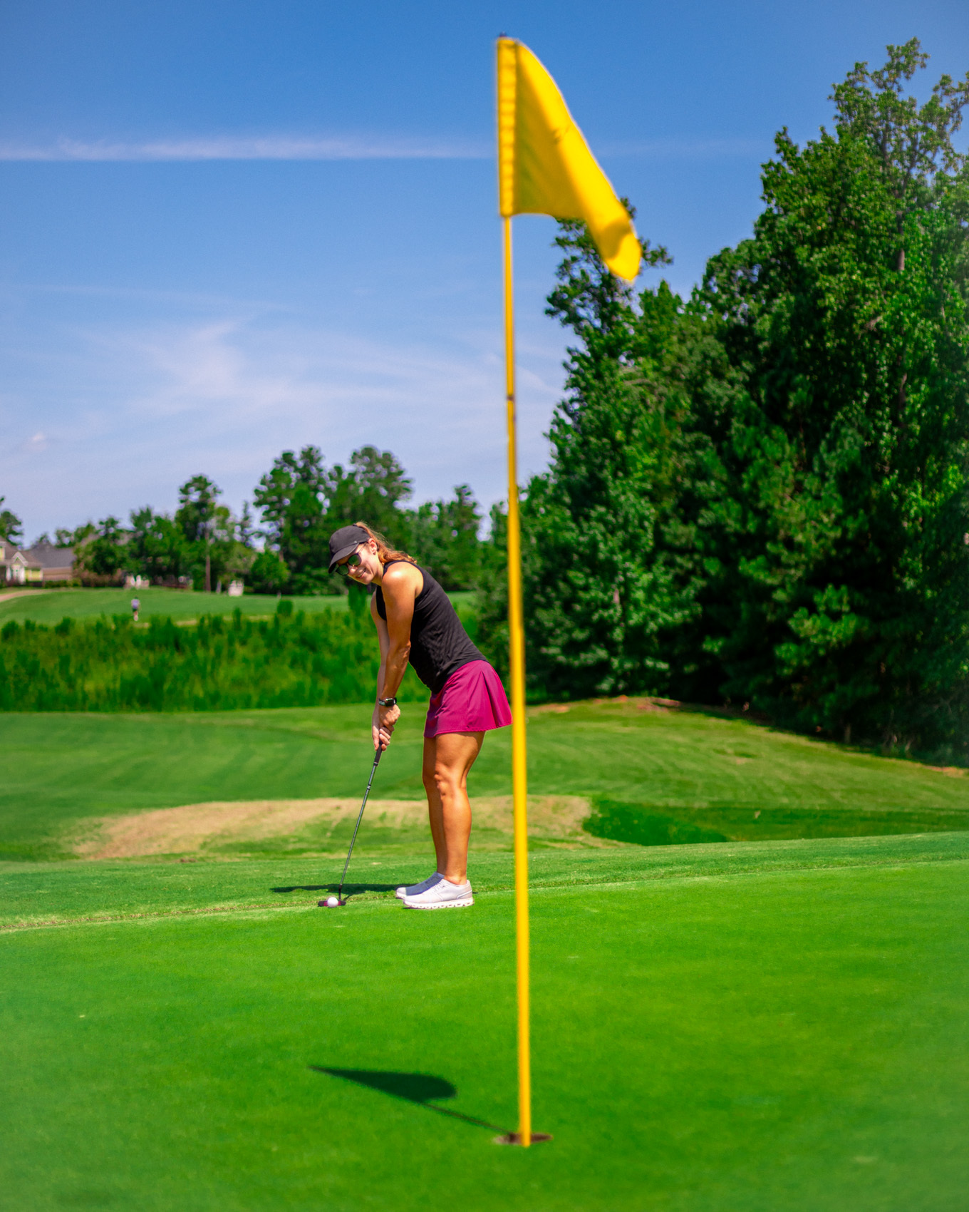 A player putts out on a Bartram Trail green